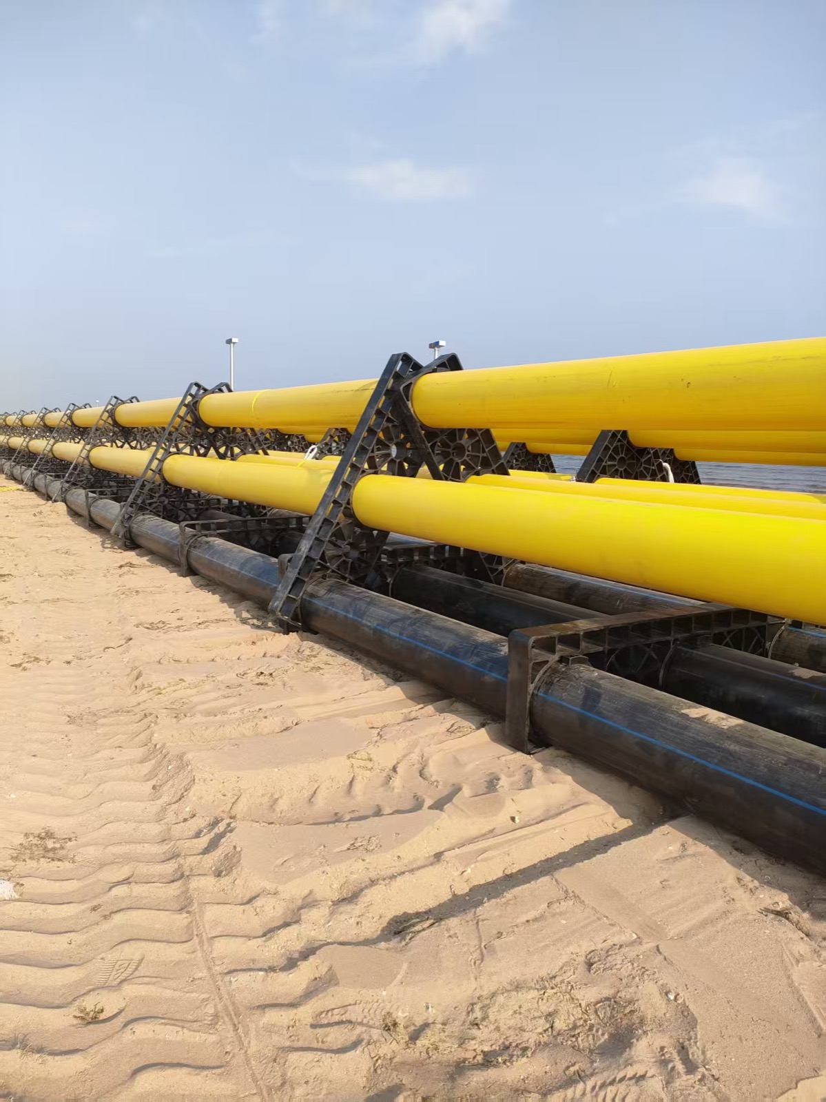 HDPE offshore fish cage system and floating pipes prepared for aquaculture project assembly
